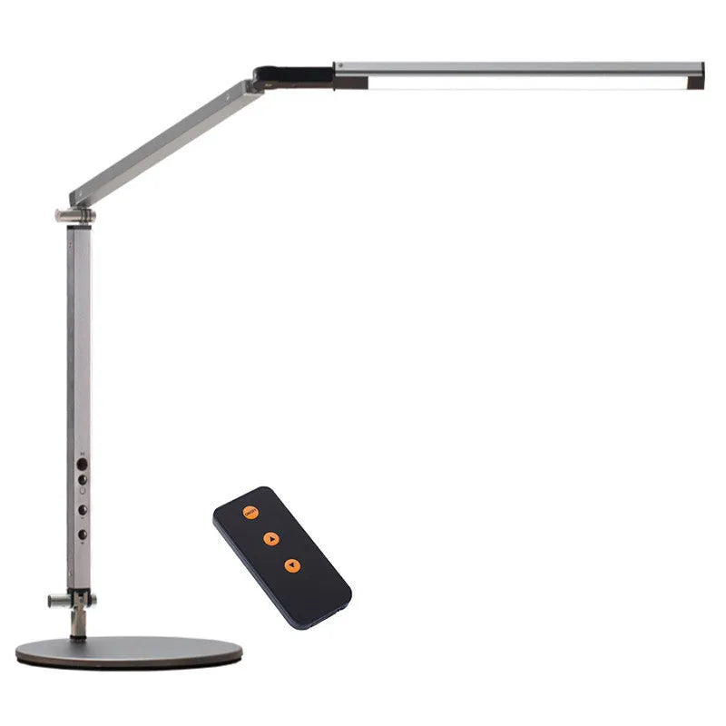 Black adjustable clip-on desk lamp with flexible arm and remote control on a wooden desk