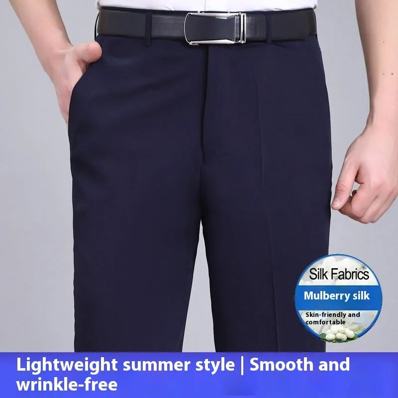 Man wearing black straight-leg high-waisted non-iron business trousers made from a Mulberry Silk blend fabric.