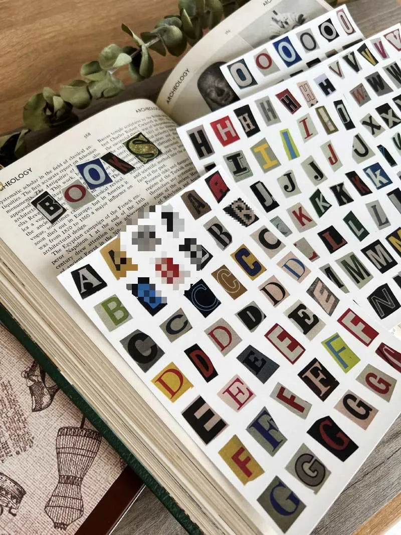 Set of printed English letter, number, and weekly word decoration stickers in assorted colours, laid out flat.
