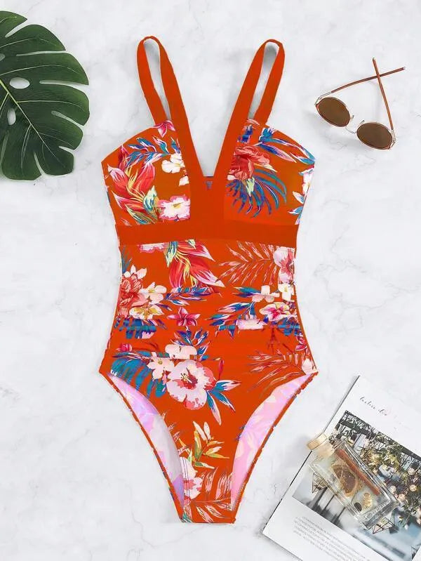 Women's floral print backless one-piece swimsuit on a mannequin.