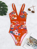 Women's floral print backless one-piece swimsuit on a mannequin.