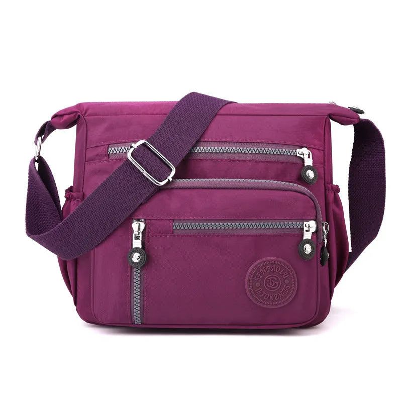 Nylon messenger bag in grey colour with single shoulder strap and square vertical design