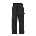 Black paratrooper pants with elastic drawstring waist and three-dimensional baggy cut