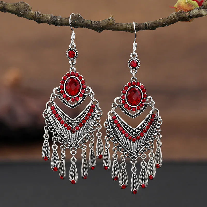 Retro purple drop earrings with long fringe detailing and ethnic design elements