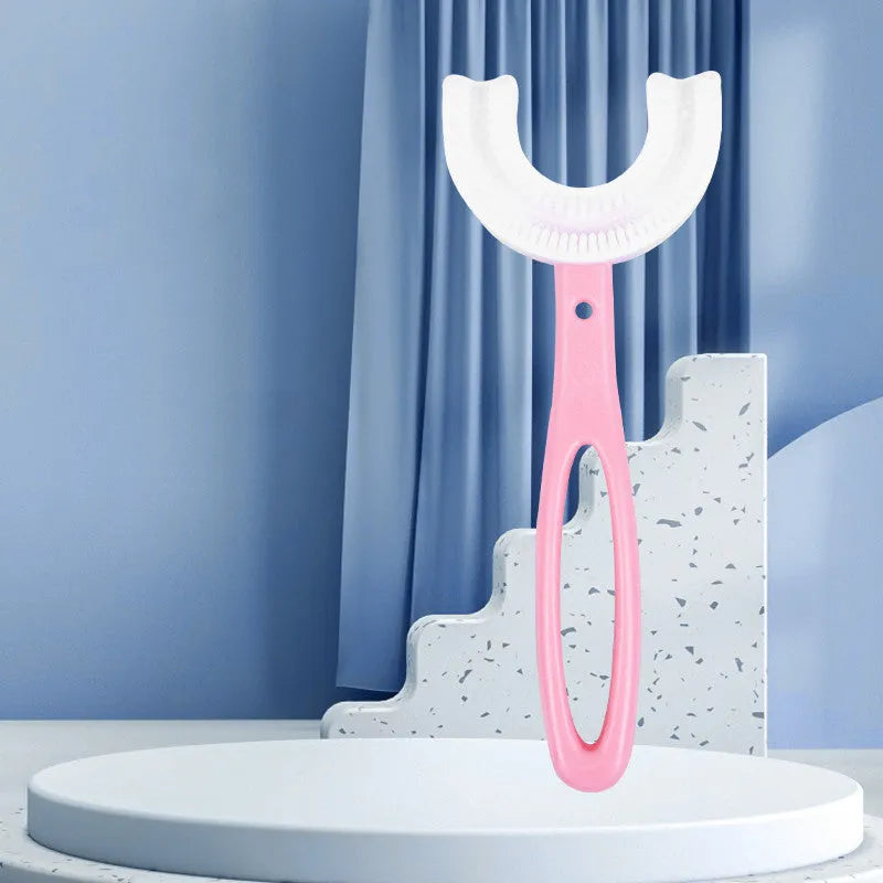 Children's U-shaped soft rubber toothbrush in pink and blue colours for milk teeth cleaning