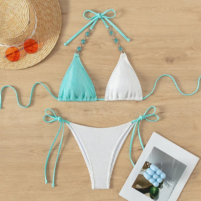Women's colour-matching swimsuit with lace-up front and pearl chain detail