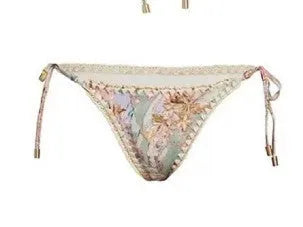 Women's creamy white floral print bikini set with matching skirt for swimming
