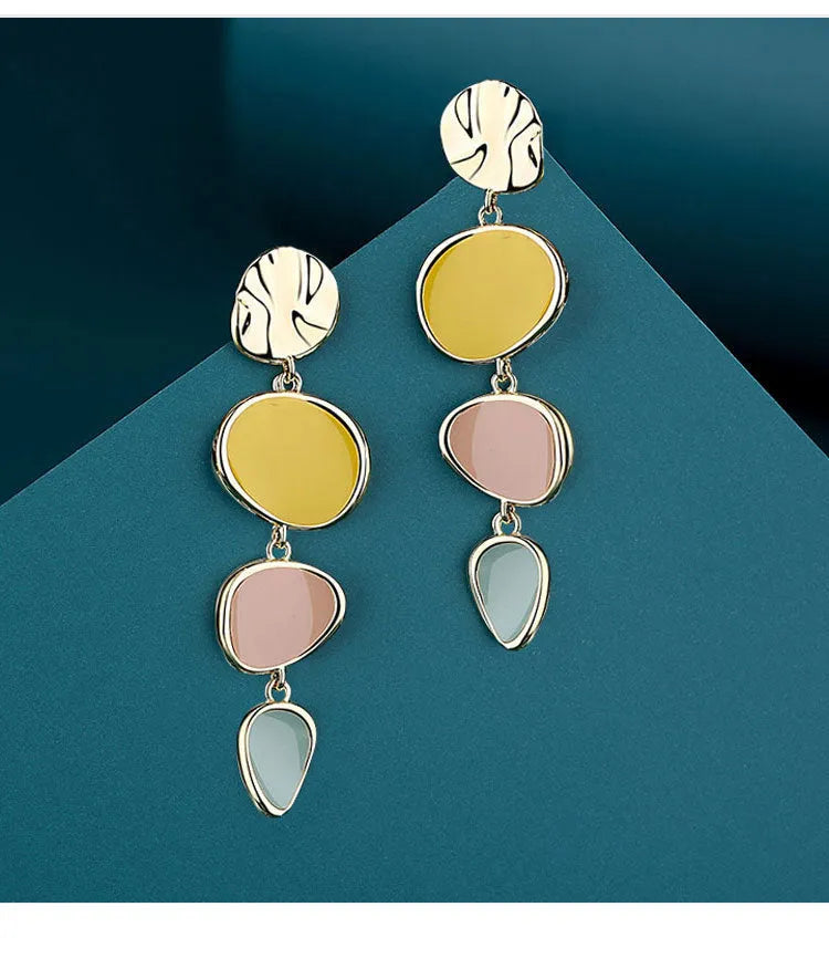 Morandi three-colour oil drip finish on disc-shaped alloy earrings with sterling silver posts.