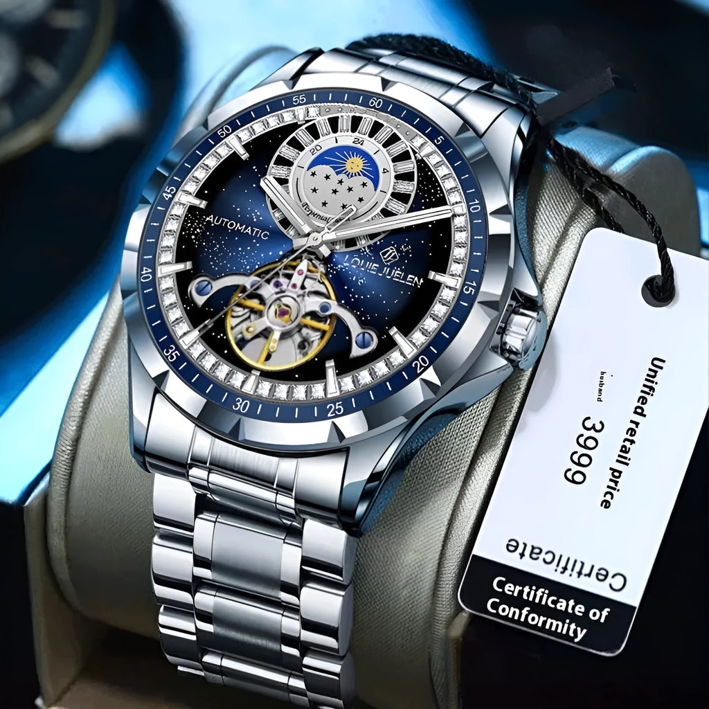 Silver automatic mechanical watch with blue dial on stainless steel bracelet showing transparent caseback