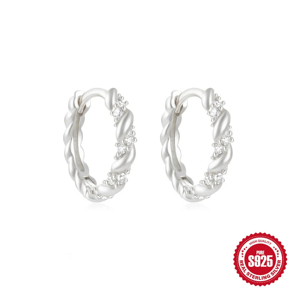 Sterling silver geometric stud earrings with small round designs in gold or silver electroplated finishes