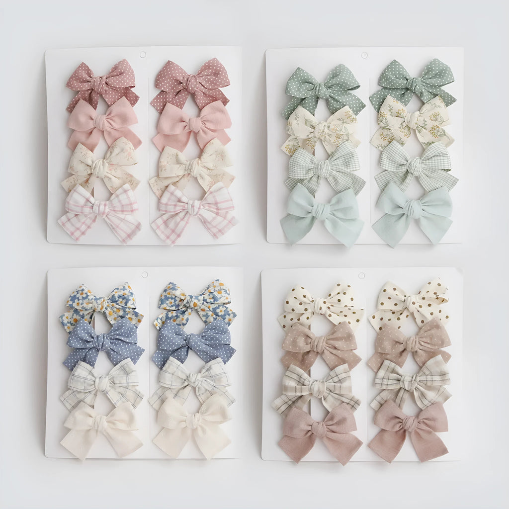 Children's fabric bow hairclips set showing dovetail design in multiple colour options