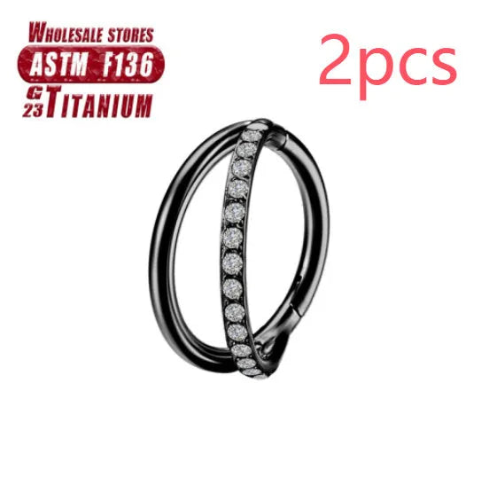 Close-up of a titanium alloy fork nose ring in silver, showing the two-prong design on a grey background.