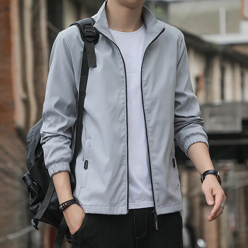 Korean style loose fit thin autumn jacket in blue with lapel collar and zip pockets.