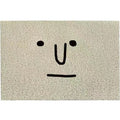 Square PVC floor mat with a cartoon facial expression and geometric pattern in Mr. Big Nose colour.
