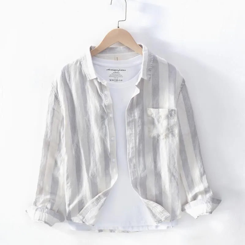 Men's loose fit blue long sleeve Hong Kong style shirt with fleece lining on a hanger.
