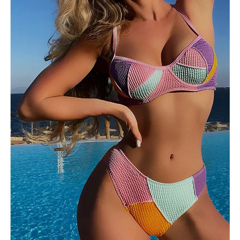 Women's spliced colour push-up bikini set with steel bracket support and matching shorts.