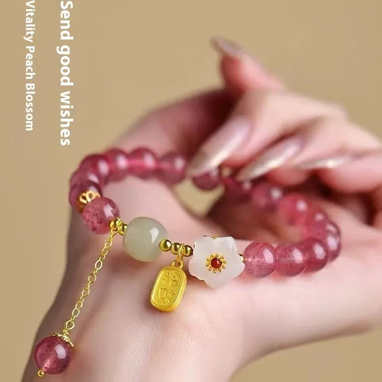 Handmade strawberry quartz crystal bracelet with Hetian jade peach blossom design showing five style variations