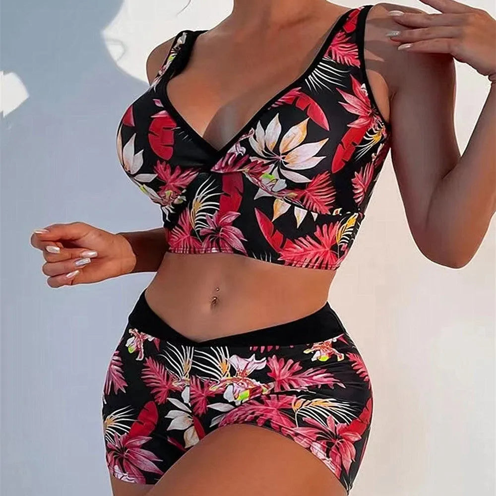Women's two-piece sleeveless swimsuit with boxer shorts in a multi-colour print.