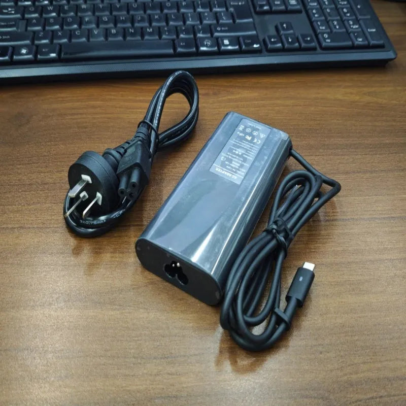 Black 65W USB Type-C laptop power adapter with international power cords