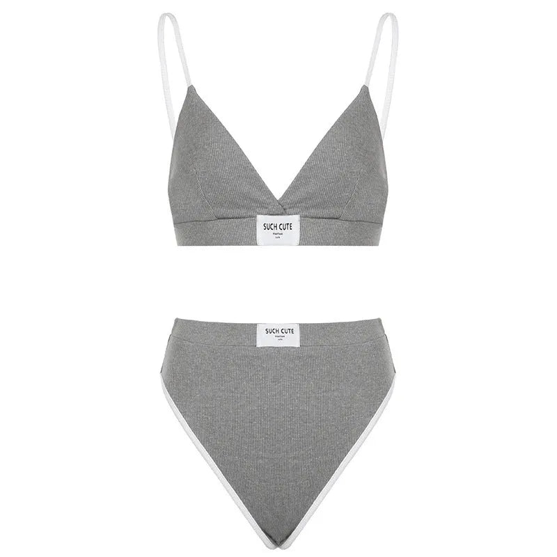 Grey women's bikini set with contrast binding and embroidery on the top and shorts.