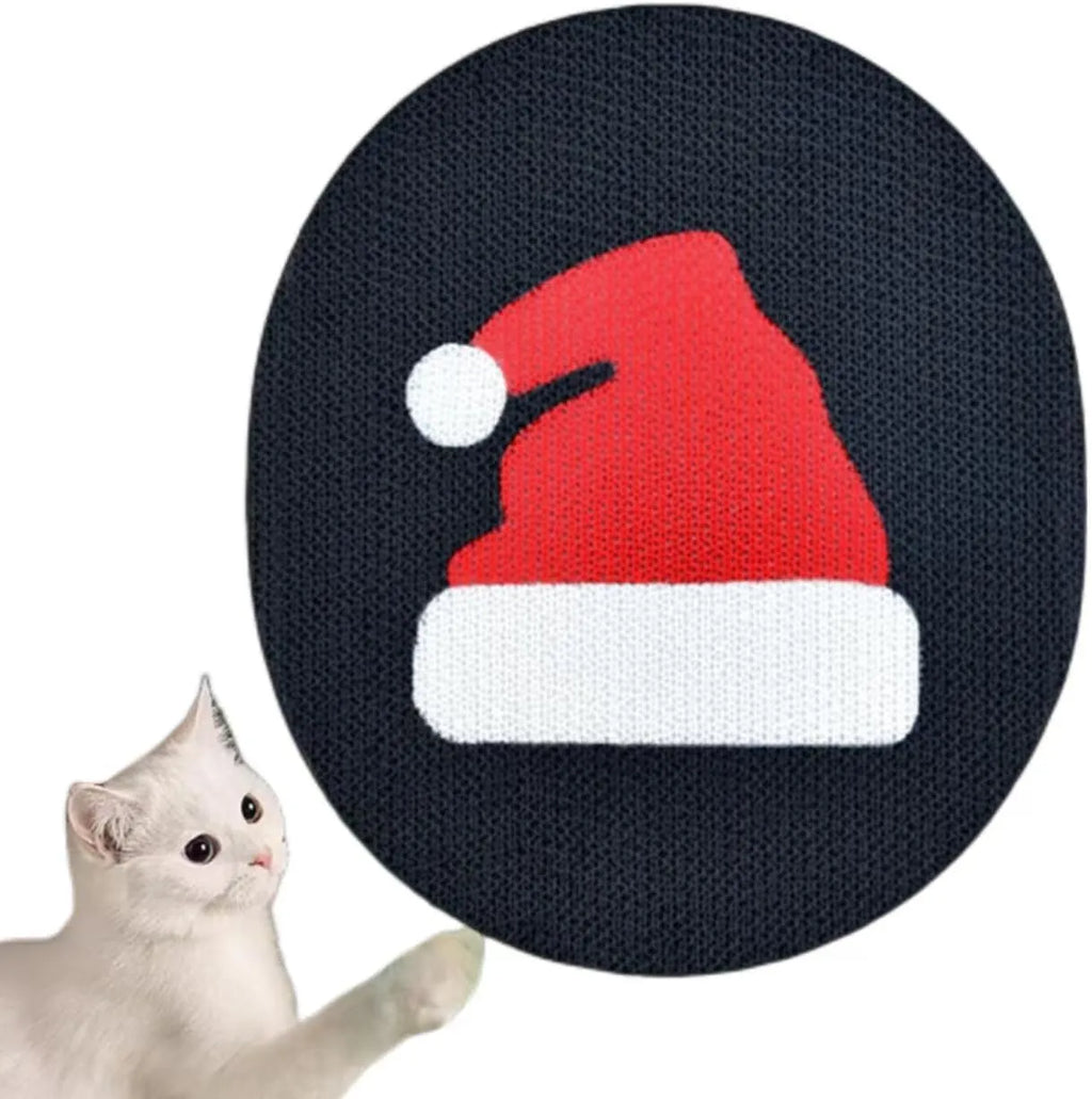 Wall-mounted corrugated cardboard cat scratcher with a decorative design on a wall.