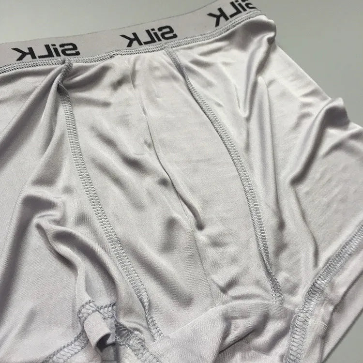 Men's silk shorts in loose fit with mid waist, available in navy blue, silver grey or skin colour