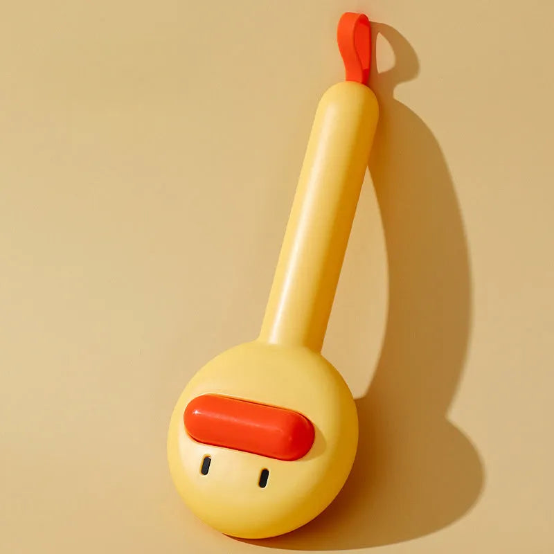 Small yellow duck-shaped pet grooming comb with open section design and needle pins for hair removal