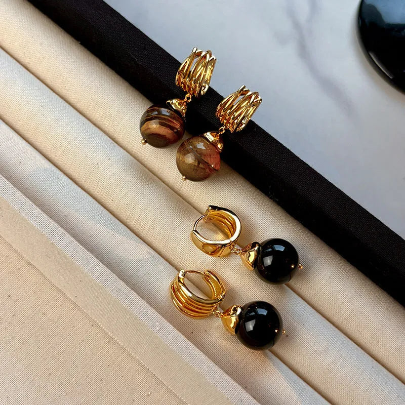 Gold-plated geometric earrings made from brown and black Tigereye stone in a French retro style.