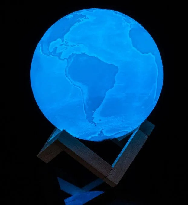3D printed spherical moon lamp on a wooden stand with touch ring control