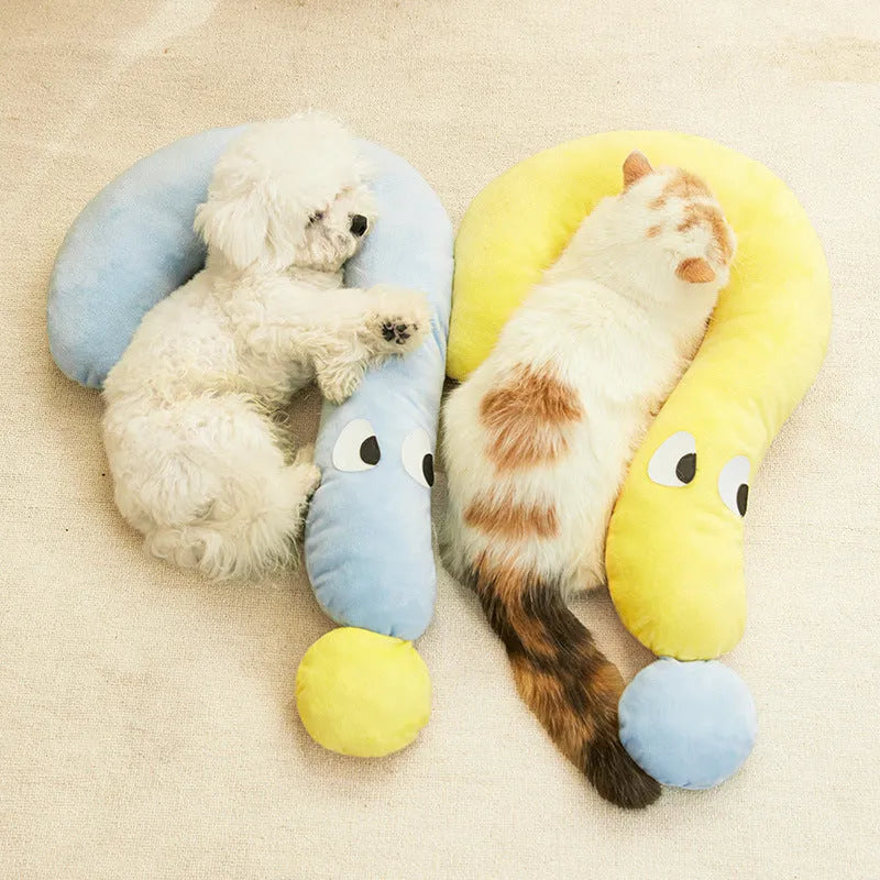 Blue or yellow rectangular pet sleeping pillow measuring 62cm by 39cm on a floor.