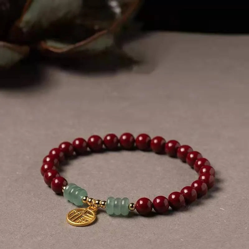 Handmade wave-shaped bracelet with alternating cinnabar and copper beads.