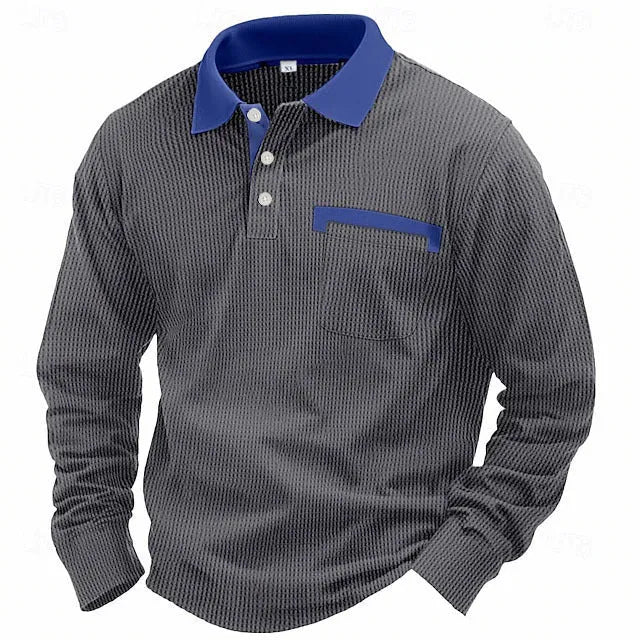 Man modelling a loose-fit long-sleeved waffle-knit polo shirt in a solid colour with an asymmetrical style detail.