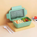 Heated four-layer partitioned bento box in Nordic style with green plastic exterior