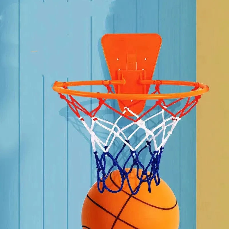Assorted bright coloured silent high-density foam basketballs in different sizes with a basketball frame.