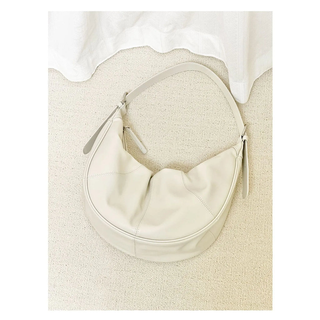 Women's genuine leather shoulder bag with dumpling shape in cowhide texture with sewing line detailing
