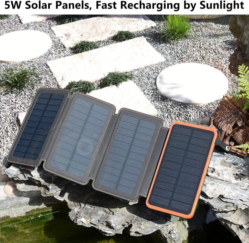 Black solar power bank with a solar panel, LED light, USB ports, and a soft leather casing.