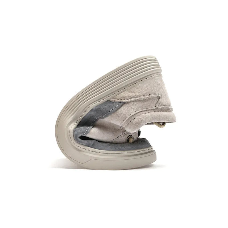 Men's grey casual skate shoes with pigskin upper and rubber sole on a white background