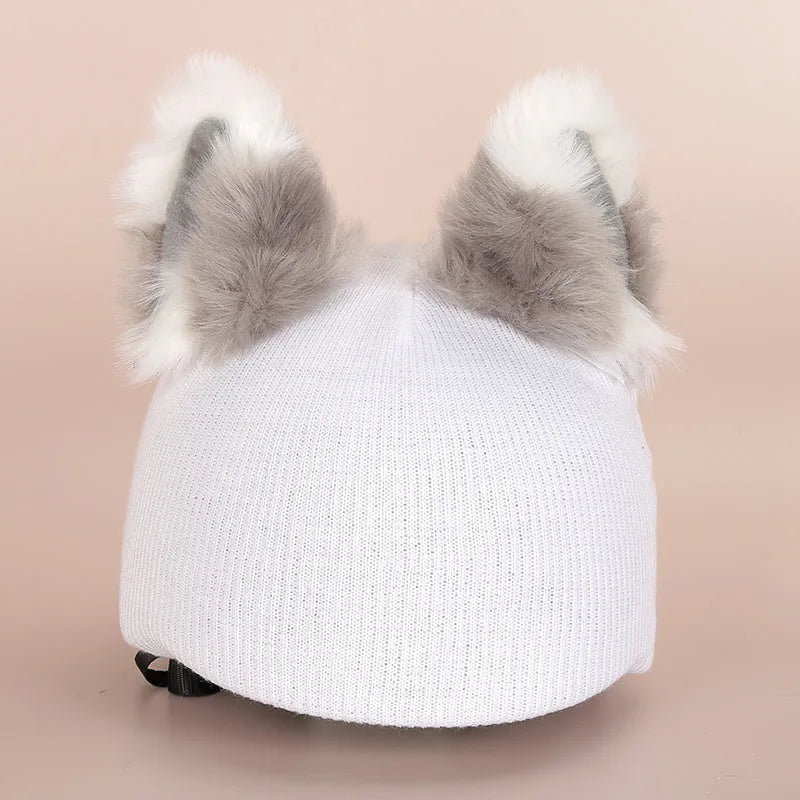 A plush fabric cartoon character helmet hat cover with attached ears on a white background.