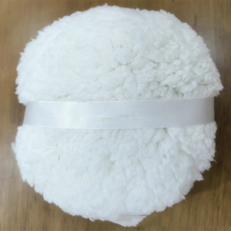 Oversized rectangular plush powder puff for makeup application in pink, white, or skin colour.