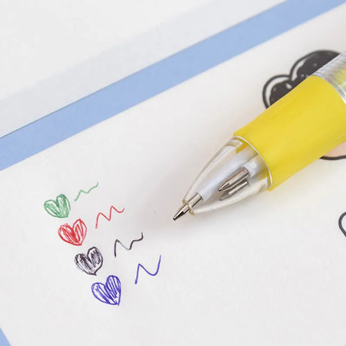 A four-colour ballpoint pen with a press top and a colourful cartoon silicone grip, showing one of five random designs.