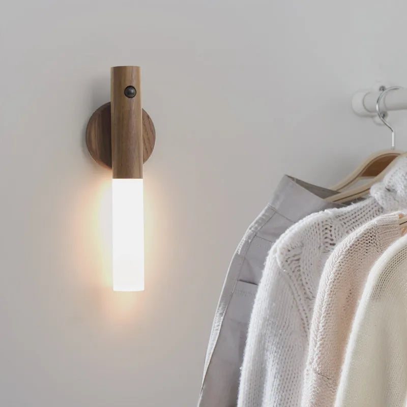 Compact wooden and acrylic motion sensor LED desk lamp on a desk