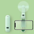 Green folding handheld mini fan with USB charging cable