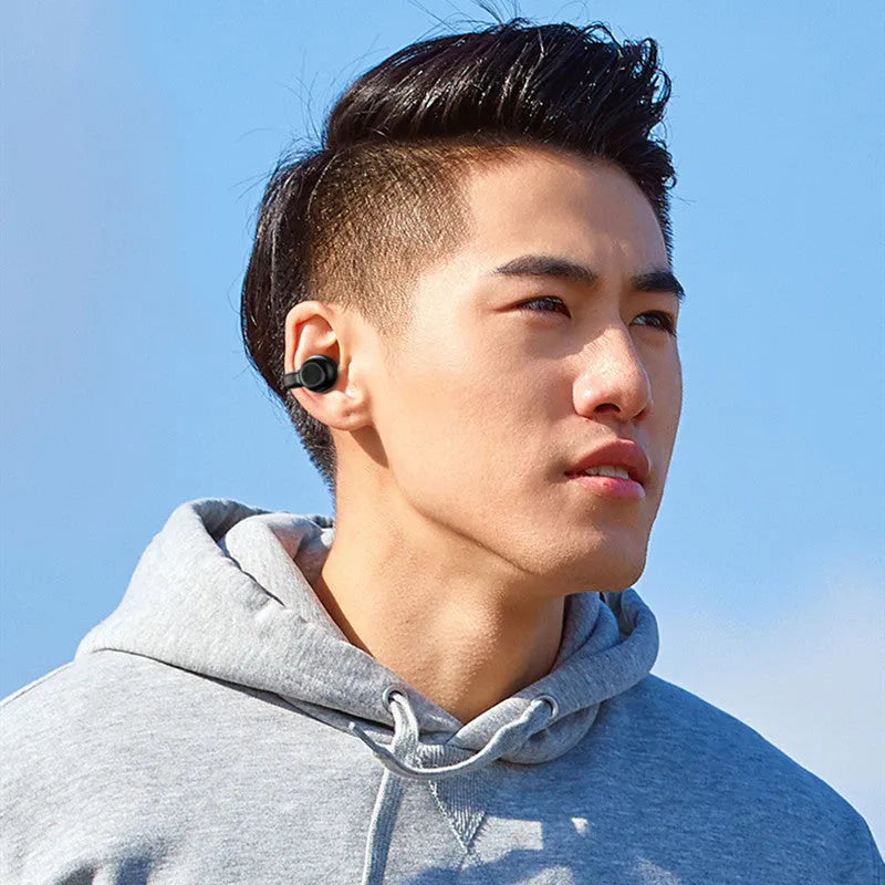 Wireless clip-on bone conduction earphones in black or white for exercise and hands-free calls