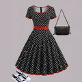 Multicolour polka dot dress with square collar, short sleeves, zip fastening, and pleated midi skirt