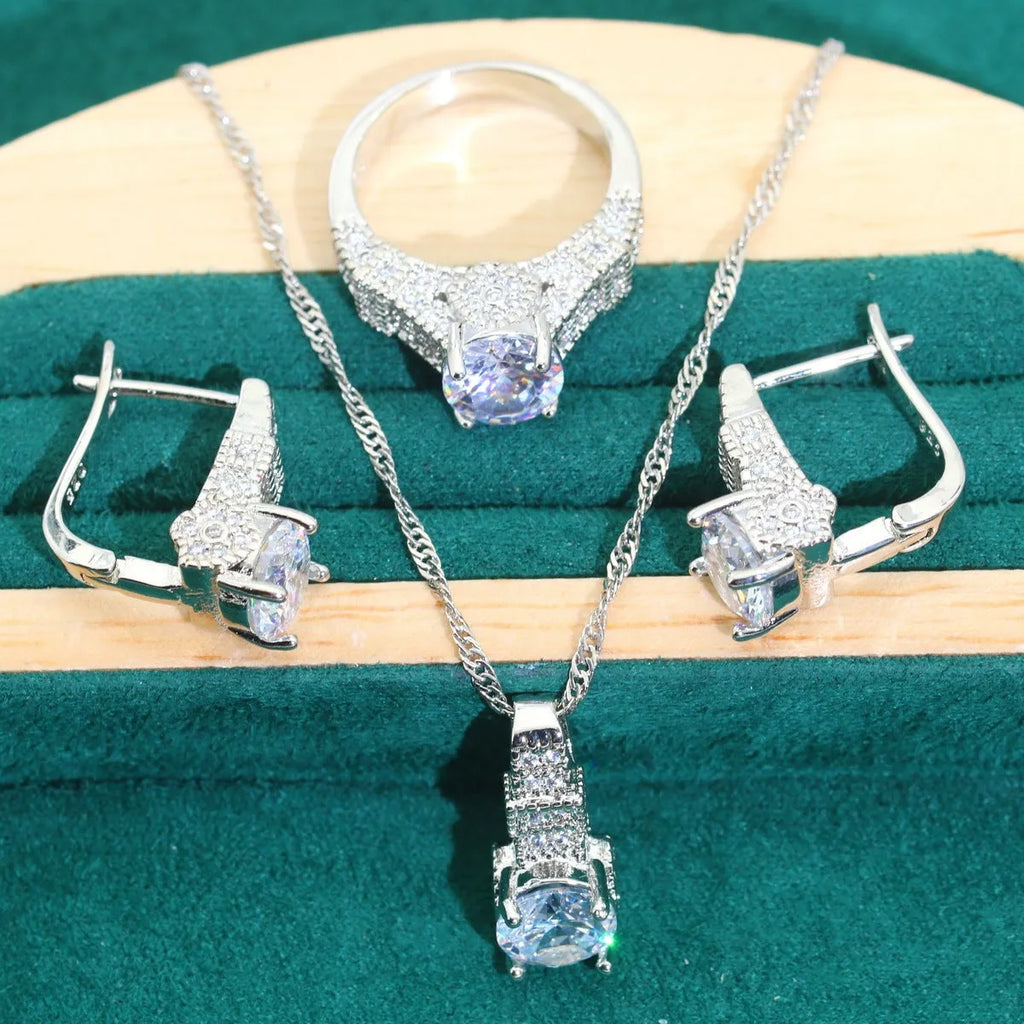 Four-piece bridal jewellery set showing necklace, earrings, ring, and bracelet with alloy pendant and water wave chain