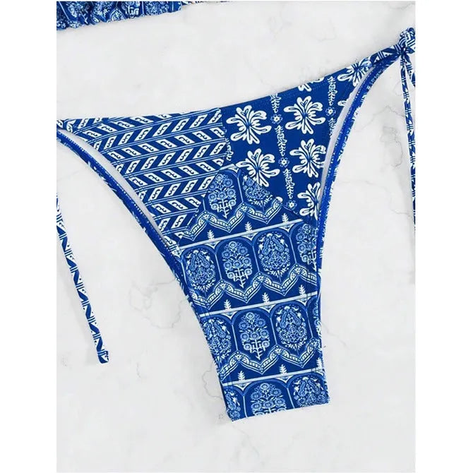 Women's green bandage style bikini swimsuit with split stitching detail on polyester fabric.