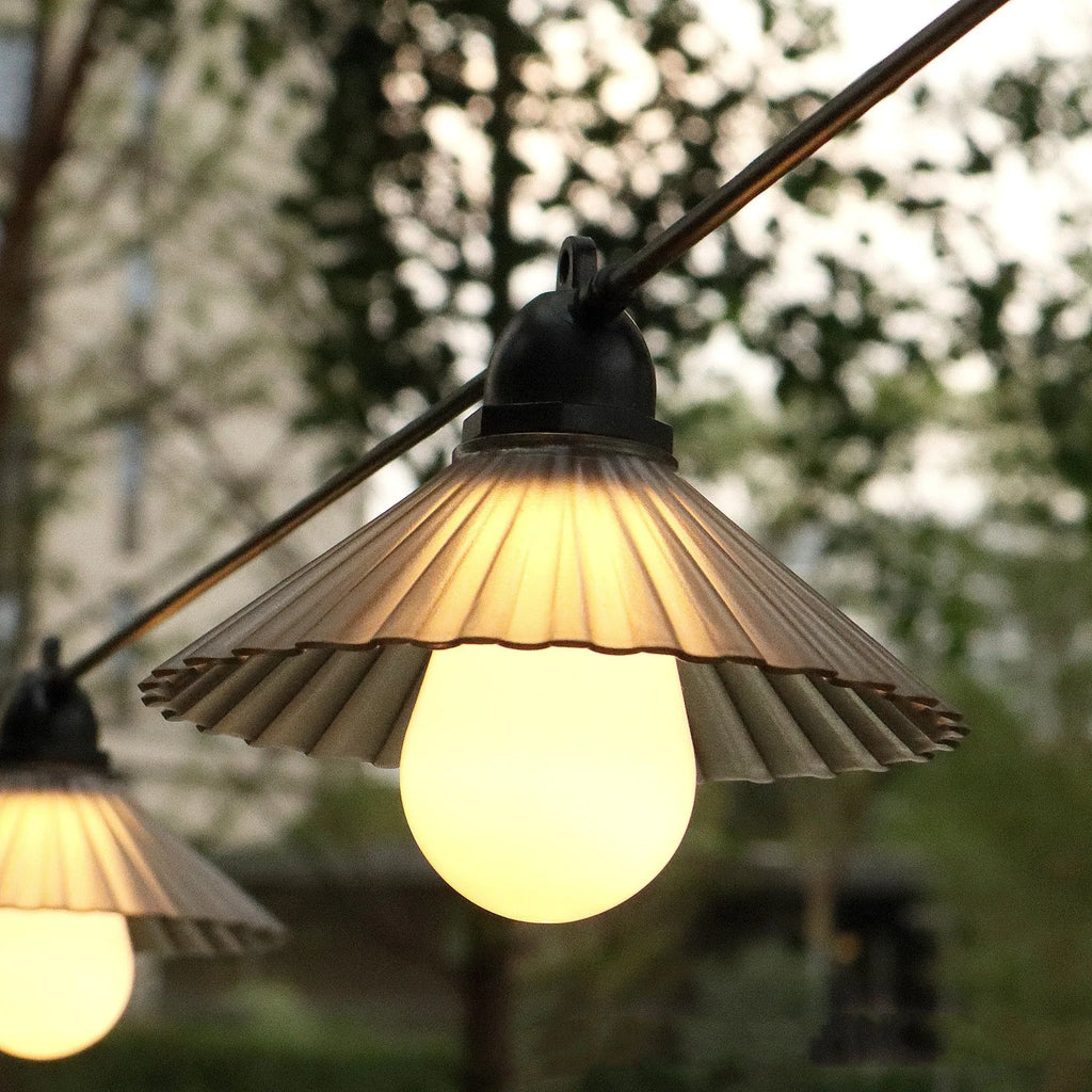 Outdoor waterproof LED string lights with flower-shaped globes in warm white and multi-colour options.