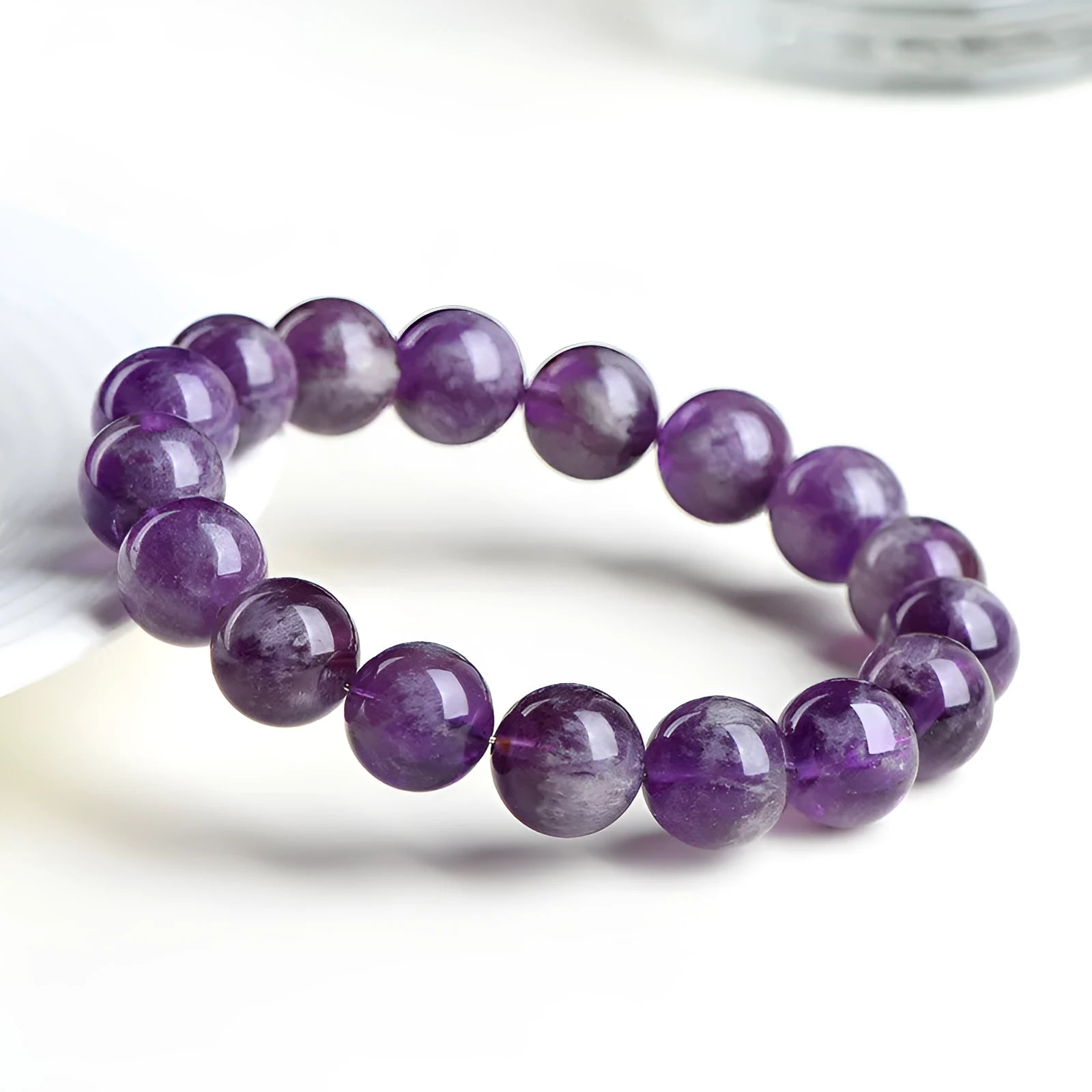 Natural feather amethyst bracelet with purple scattered beads and geometric Ruyi design