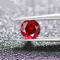 Artificial pigeon blood red ruby gemstone in various cuts: egg, round, princess, water drop, grandmother, and Asche.