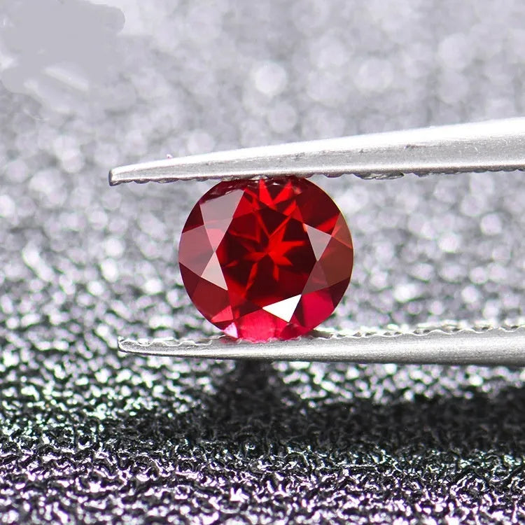 Artificial pigeon blood red ruby gemstone in various cuts: egg, round, princess, water drop, grandmother, and Asche.